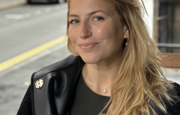 Woman looking at a camera.