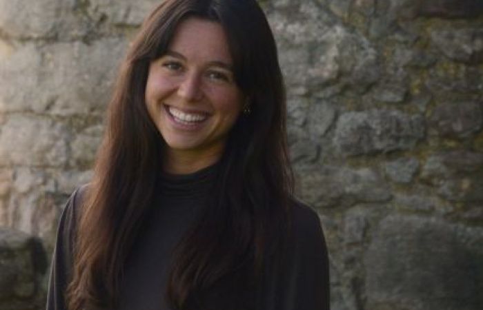 Brunette woman portrait. Stone background.