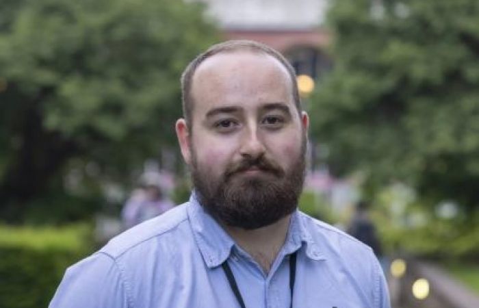 Portrait image of Ewan Forrest looking towards the camera.